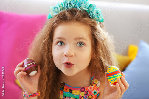 Little girl with Easter egg...