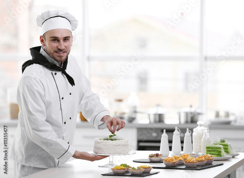 Male chef working at kitchen