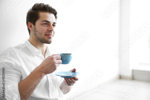 Handsome man drinking coffe...