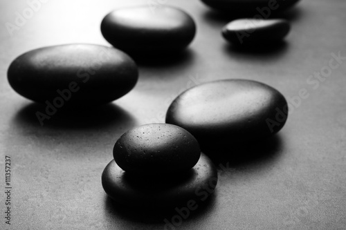 Heap of spa hot stones  on grey background