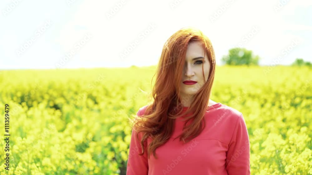 Girl in the rape blossom and sky horizon smiling to the camera, wind blow 4k Girl in the rape blossom and sky horizon smiling to the camera, wind blow 4k