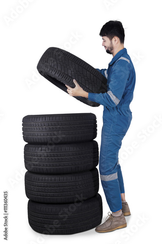 Arabic mechanic pile up tires © Creativa Images