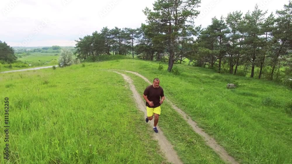 Aerial view of runner crossing on the path 4k Aerial view of runner crossing on the path 4k