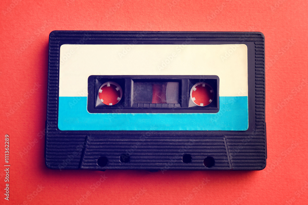 Obraz premium Old audio cassette on red background