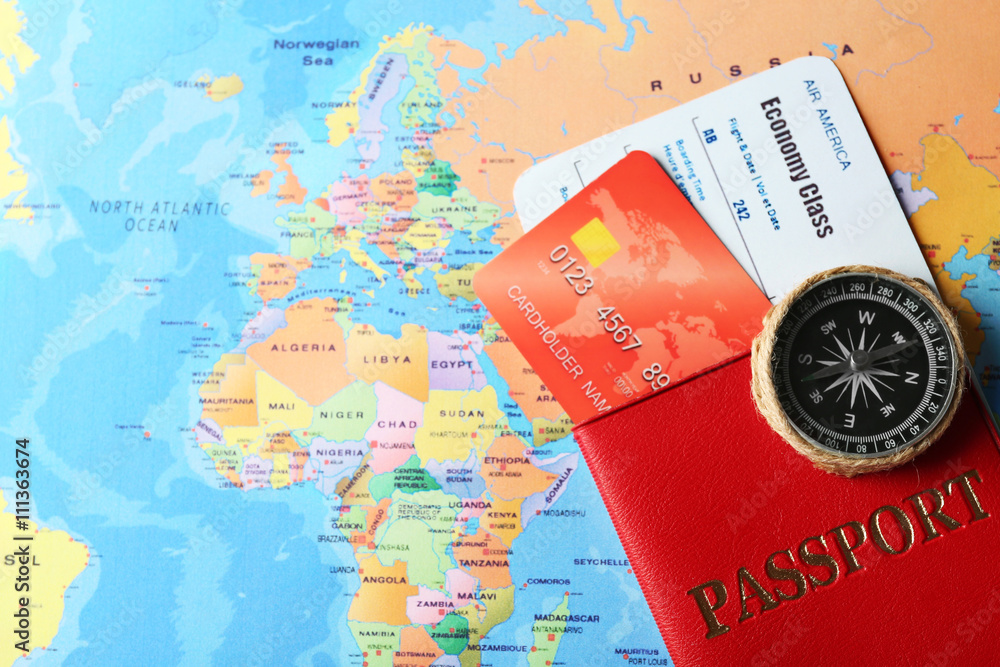 Credit cards with passport and tickets for vacations on the world map background Credit cards with passport and tickets for vacations on the world map background