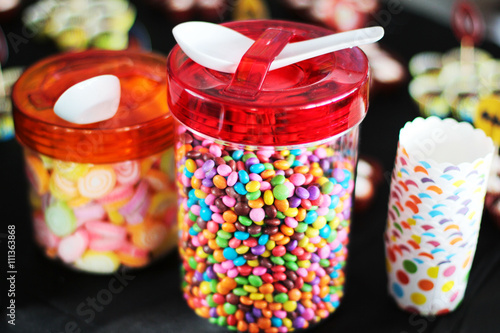 Various sugary candy in a glass jar
