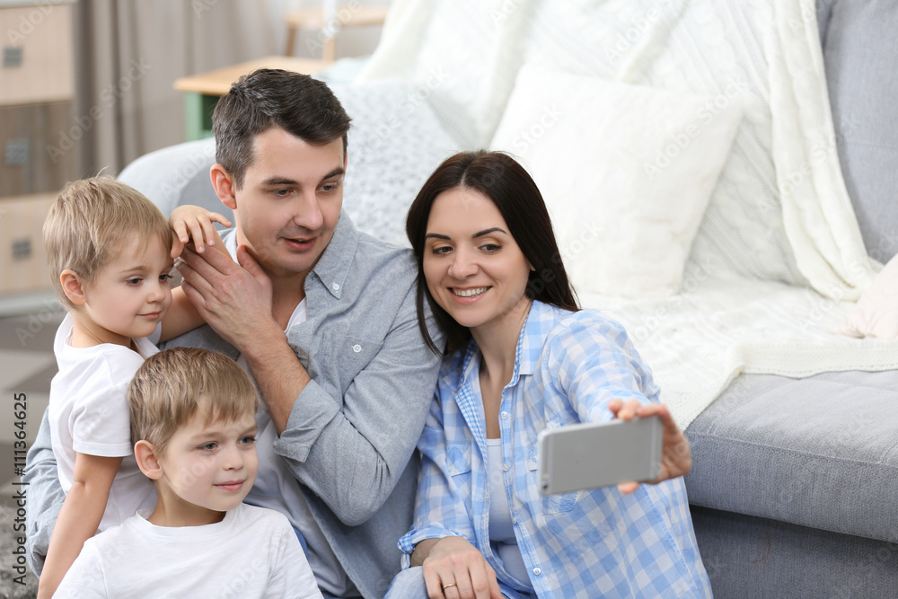 Happy family making selfie on couch background Happy family making selfie on couch background