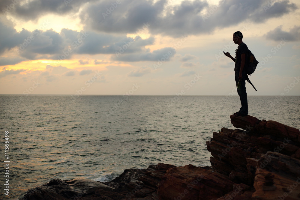 Man silhouette and mountain in Rayong at Thailand Man silhouette and mountain in Rayong at Thailand