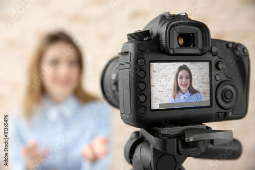 Young female blogger on cam...