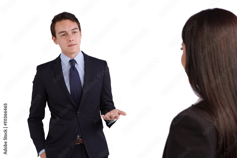 Young Caucasian business man reprimanding a business woman