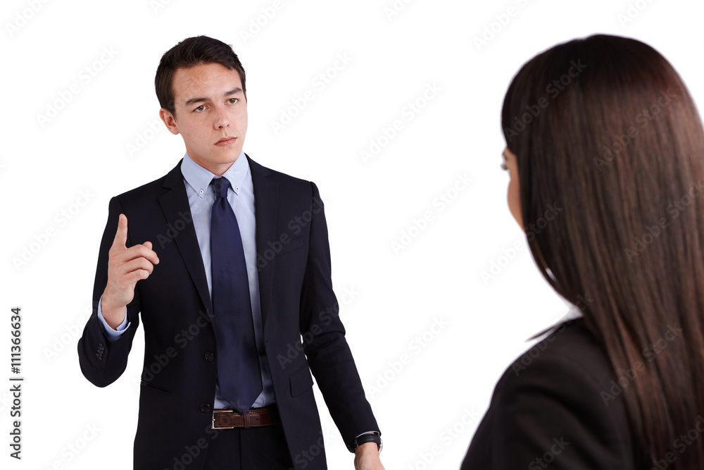 Young Caucasian business man reprimanding business woman Young Caucasian business man reprimanding business woman