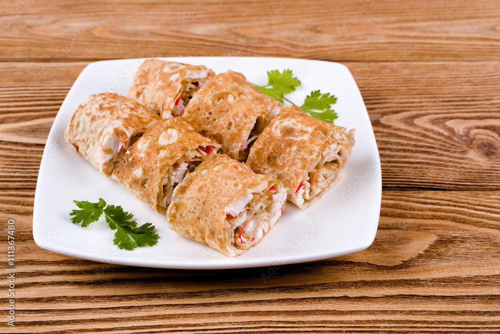  Pita rolls with cheese, greens and crab sticks 