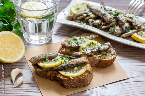 Snack from sandwiches with sardines.