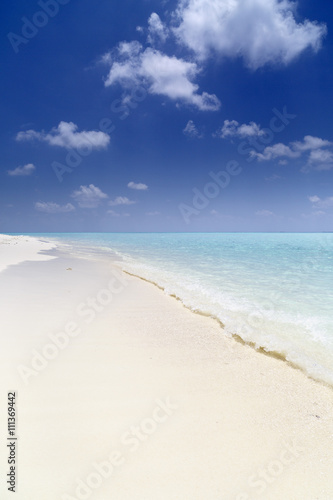 Beautiful island beach with sandspit at Maldives