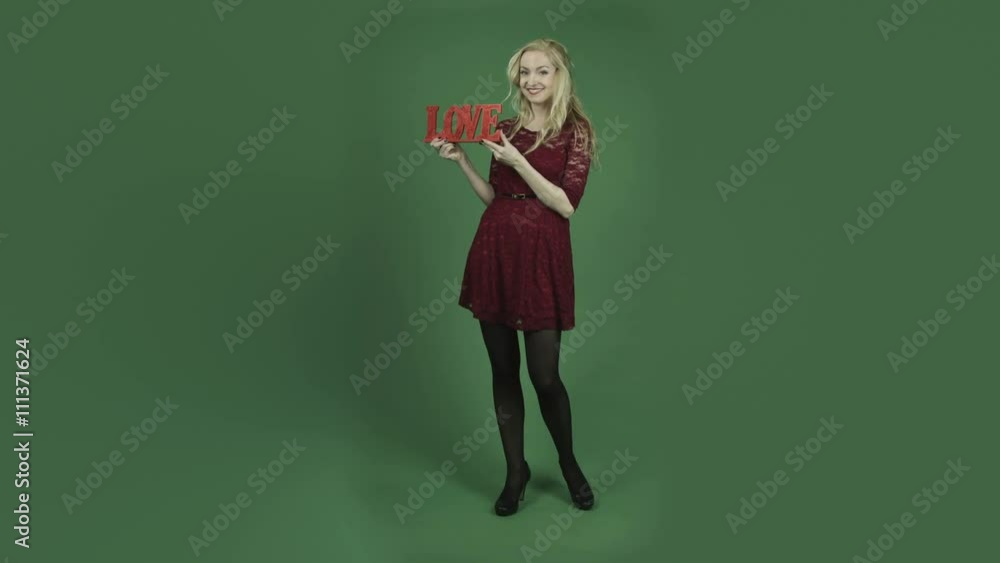 caucasian woman in red dress isolated on chroma green screen background smiling romance caucasian woman in red dress isolated on chroma green screen background smiling romance