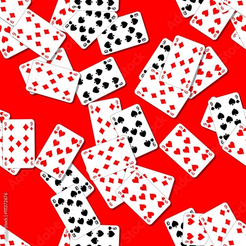 seamless pattern texture background with playing cards irregularly scattered on the red table