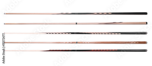 billiard cue sticks on white background photo