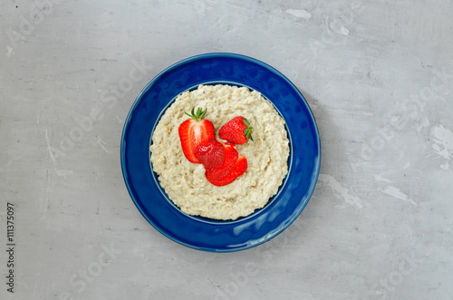 Oatmeal porridge with strawberries photo