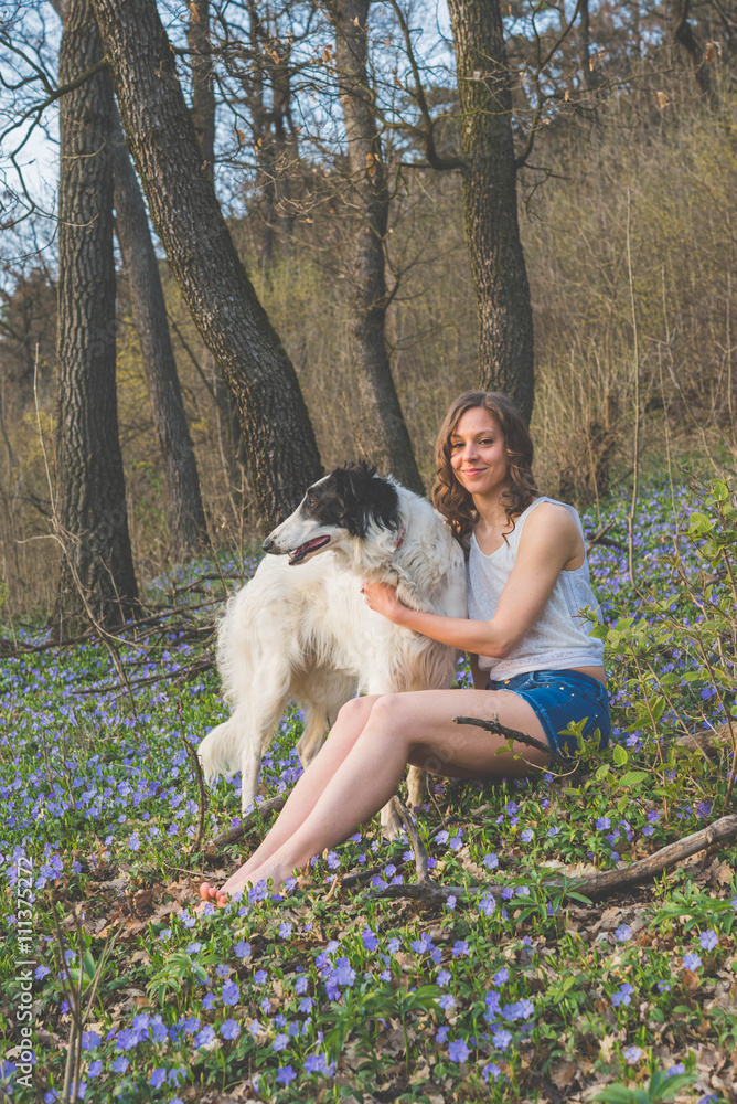 Woman sitting with dog in outdoor Woman sitting with dog in outdoor