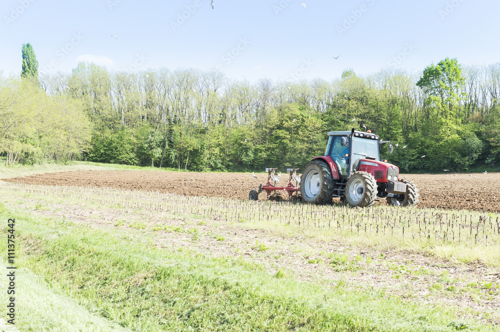 Tractor plowing the fields Tractor plowing the fields