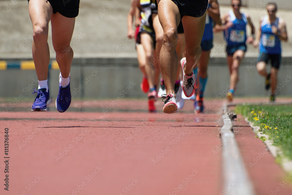 Athletics people running on the track field Athletics people running on the track field