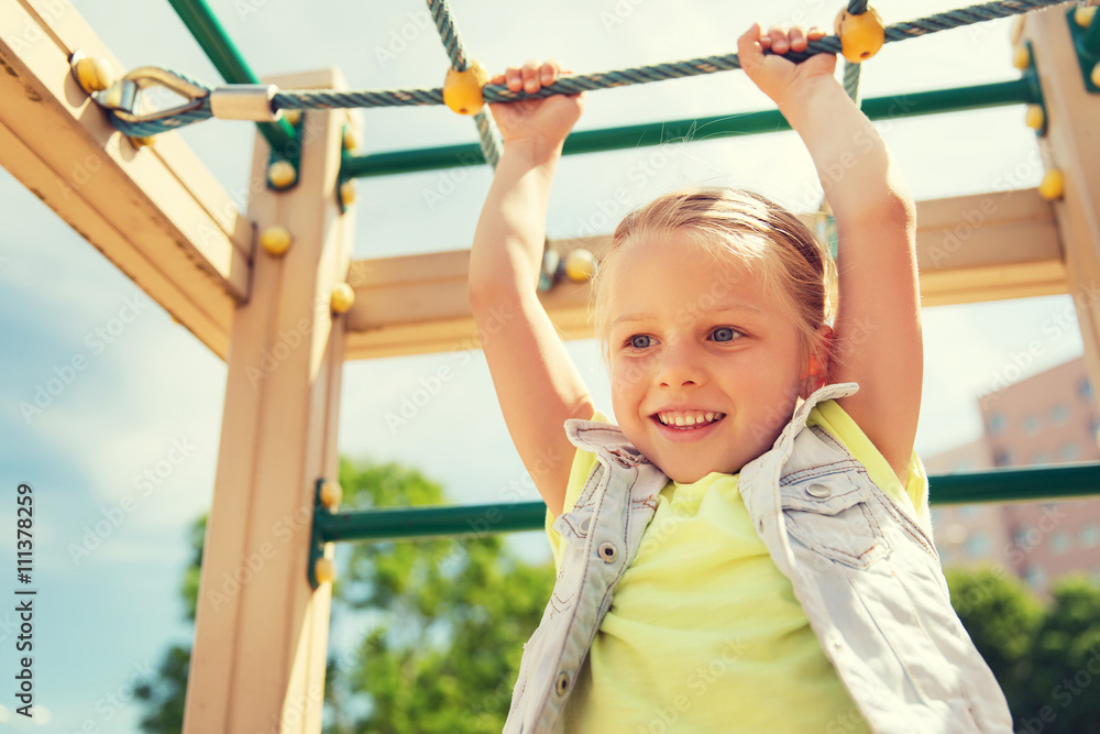 happy little girl climbing on children playground happy little girl climbing on children playground