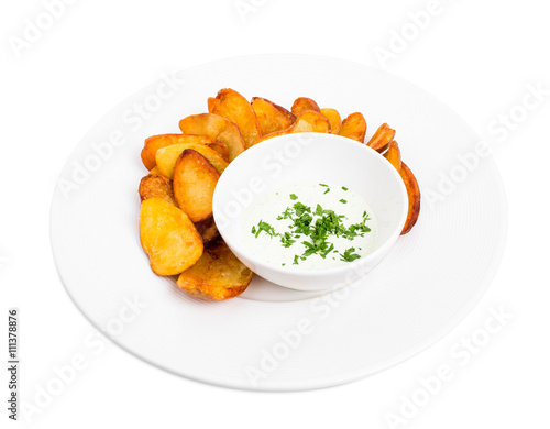 Roast potato wedges with tartar sauce.