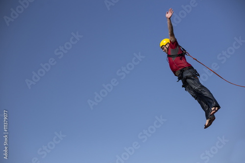 Man jumping off a cliff.