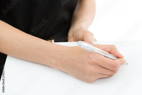 Woman hands signing a paper