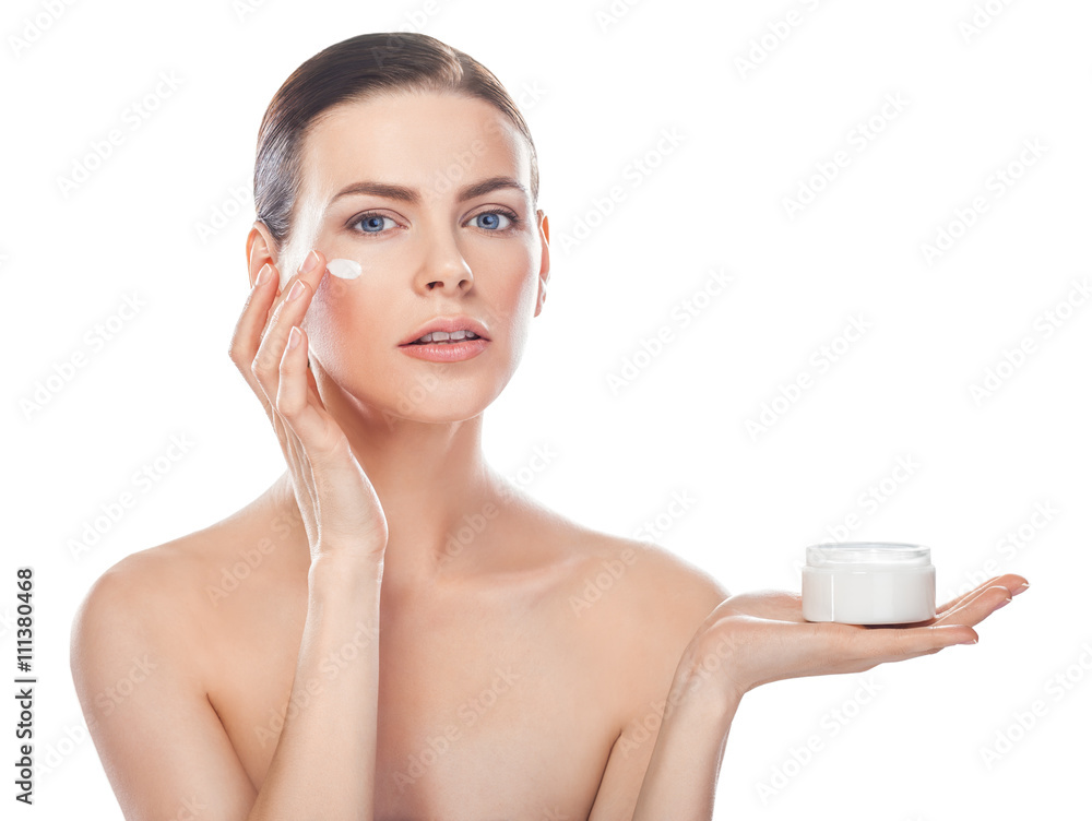 beautiful young woman with jar of cream and cosmetic cream on a beautiful young woman with jar of cream and cosmetic cream on a