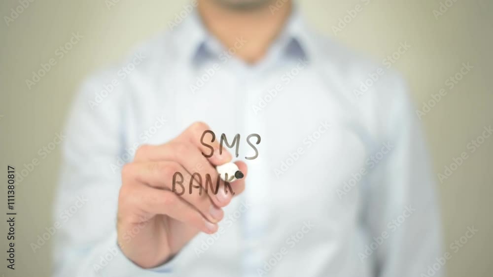 SMS Banking, Man writing on transparent screen SMS Banking, Man writing on transparent screen