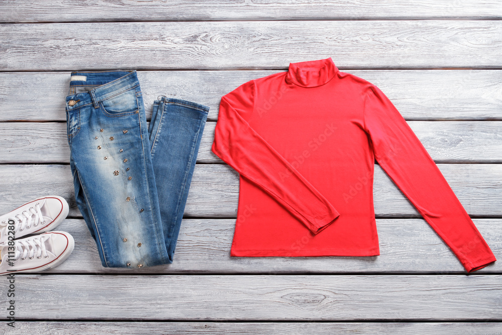 Blue jeans and red top. Long sleeve top and shoes. Outfit with