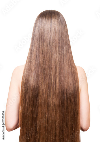Woman with beautiful brown long hair isolated on white background.