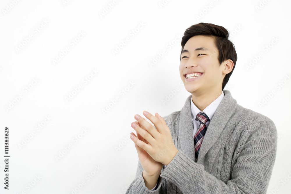 Asian young business man is clapping his hands Asian young business man is clapping his hands