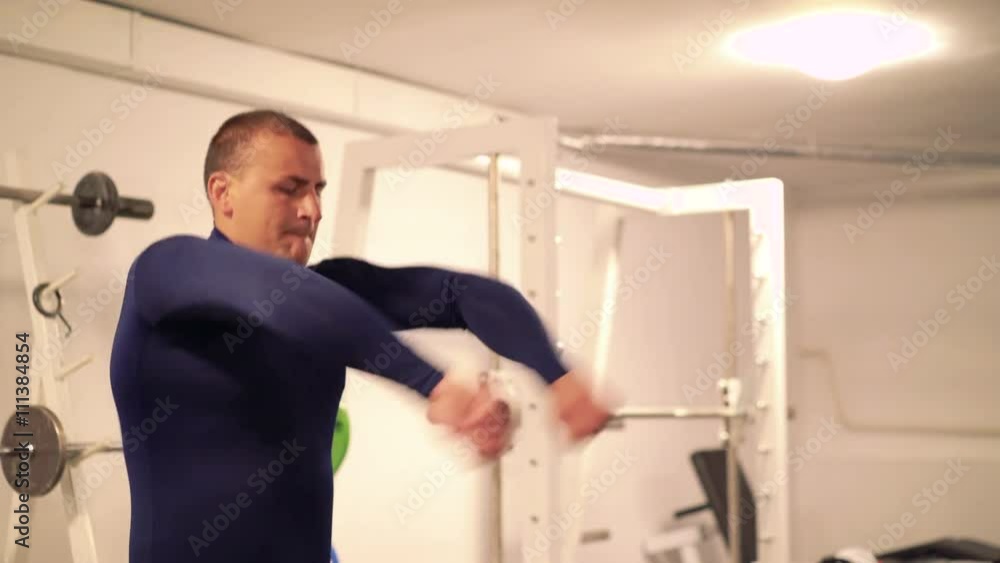 Athlete doing exercise for arms and hands in the modern gym. 4k Athlete doing exercise for arms and hands in the modern gym. 4k