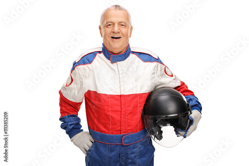 Mature car racer holding a helmet