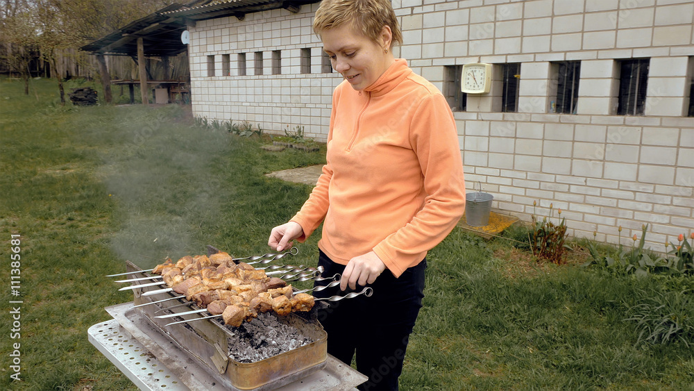 Barbeque skewers with meat cooking on hot coal ember brazier Outdoors picnic concept. Barbeque skewers with meat cooking on hot coal ember brazier Outdoors picnic concept.