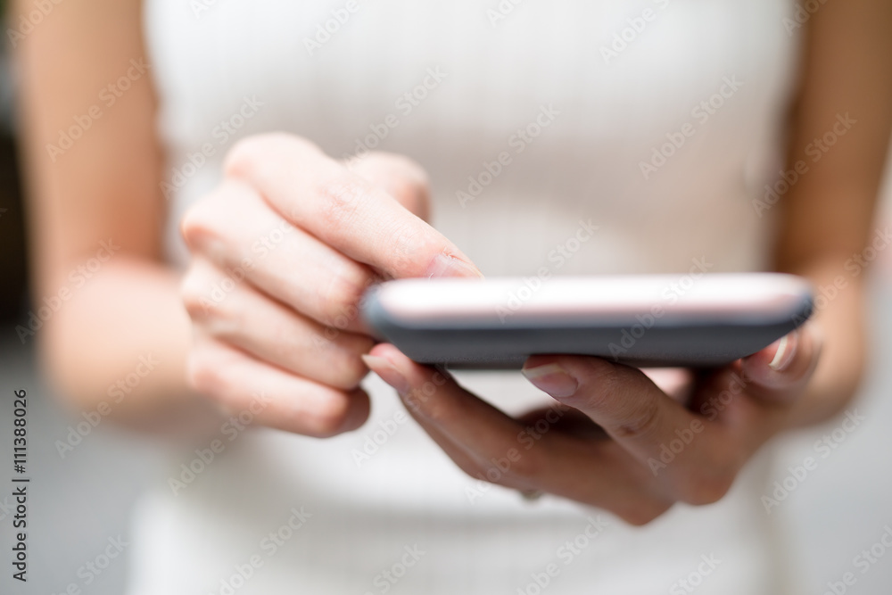 Close up of woman sending sms on cellphone Close up of woman sending sms on cellphone