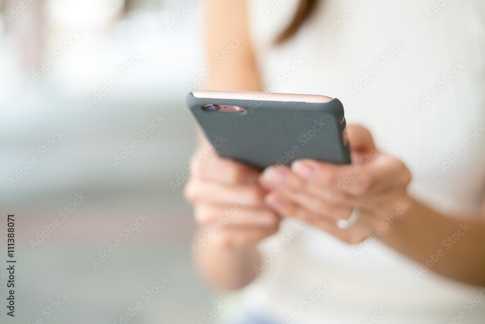 Close up of woman sending sms on mobile phone Close up of woman sending sms on mobile phone