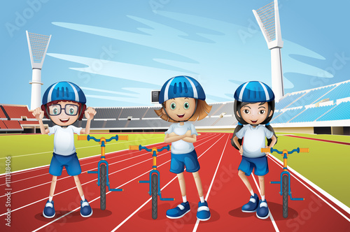 Three kids riding bike on the track