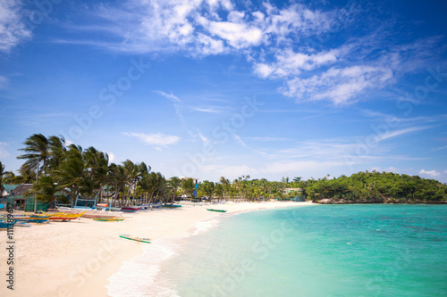 Tropical beach with clear emerald water