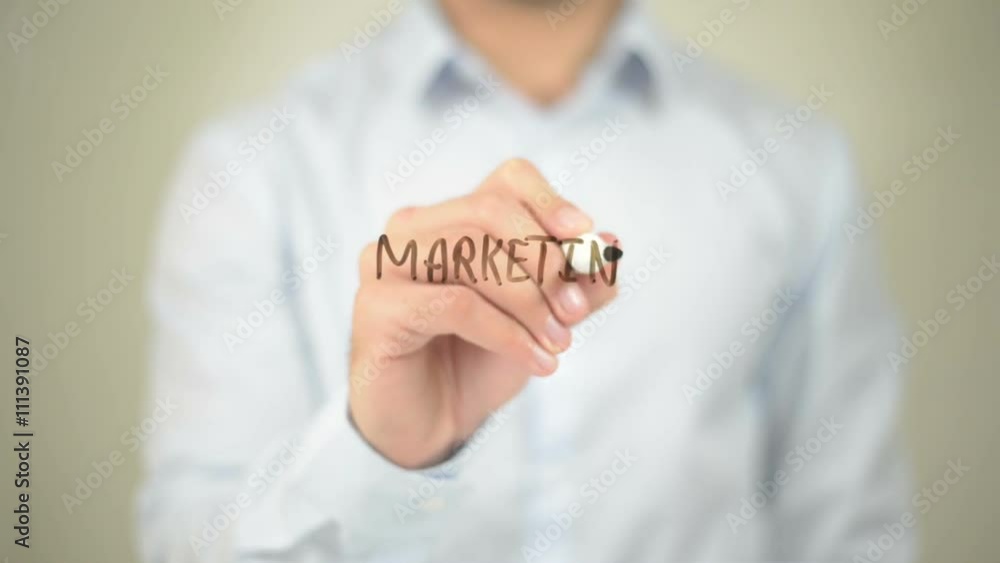 Marketing Strategy,, Man writing on transparent screen Marketing Strategy,, Man writing on transparent screen