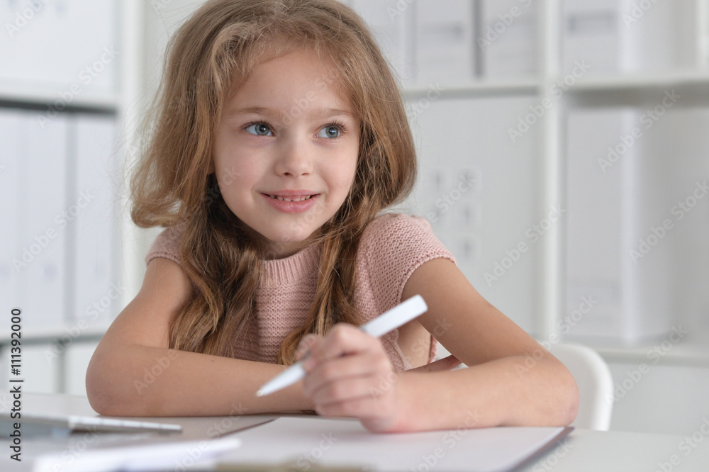  little student girl making homework