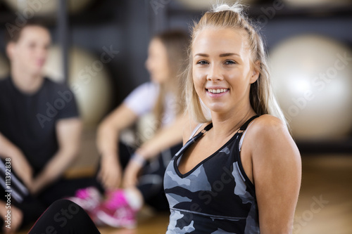 Confident Fit Woman Smiling In Gym