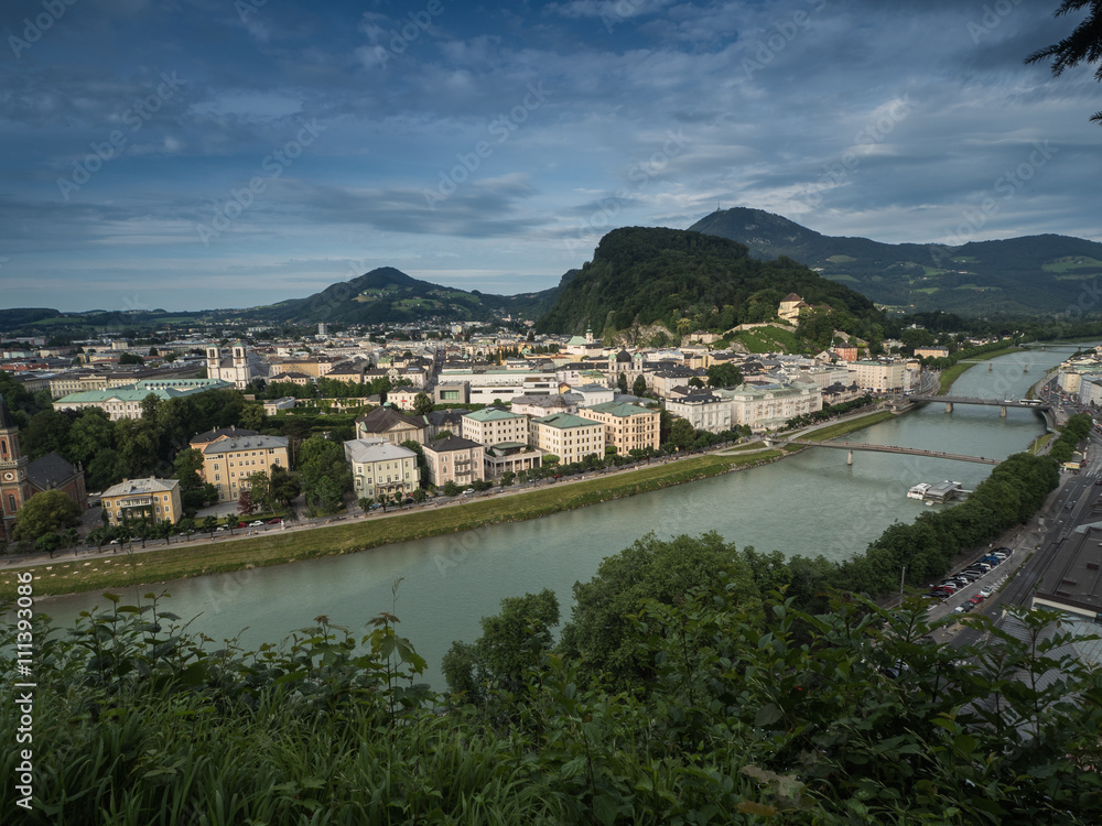 A view of the houses standing round the floating river Salzach in Salzburg, 2015