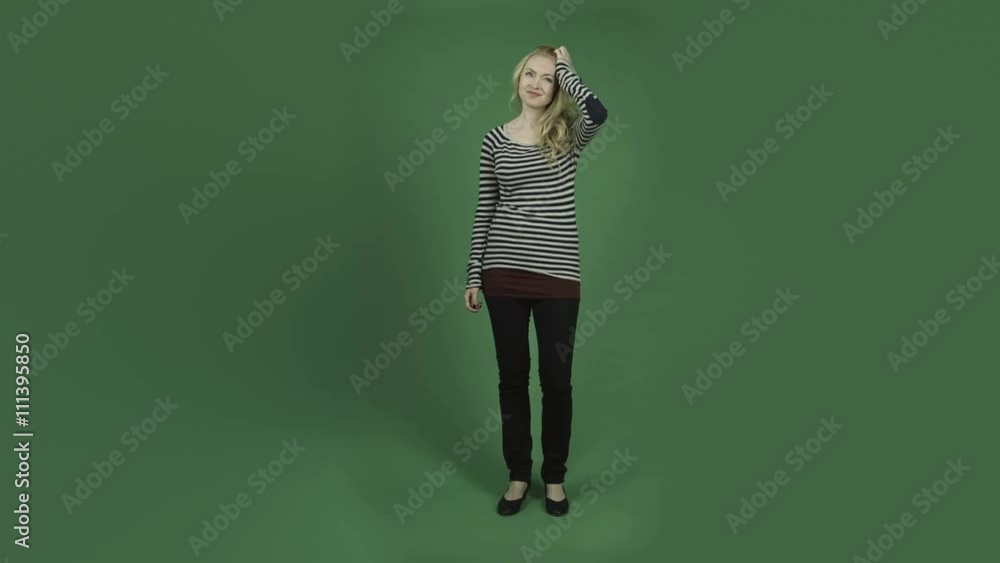 caucasian woman isolated on chroma green screen background thinking scratching head caucasian woman isolated on chroma green screen background thinking scratching head