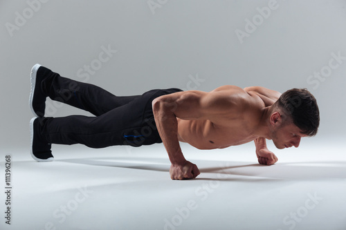 Fitness man doing plank exercise