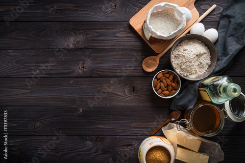 Ingredients for baking on a wooden background top view