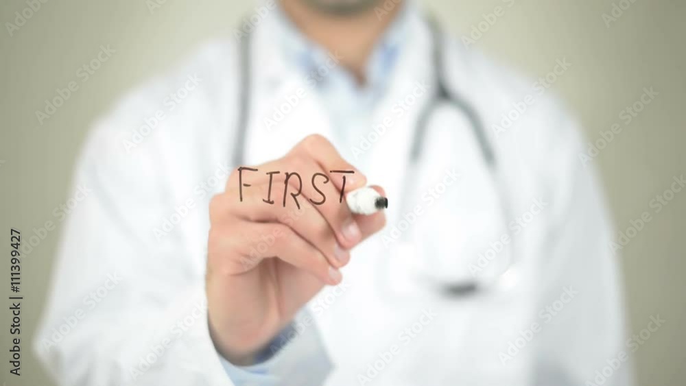 First Aid, Doctor writing on transparent screen First Aid, Doctor writing on transparent screen