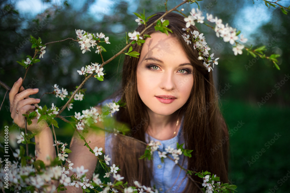 dreaming young woman with blooming cherry tree in garden dreaming young woman with blooming cherry tree in garden